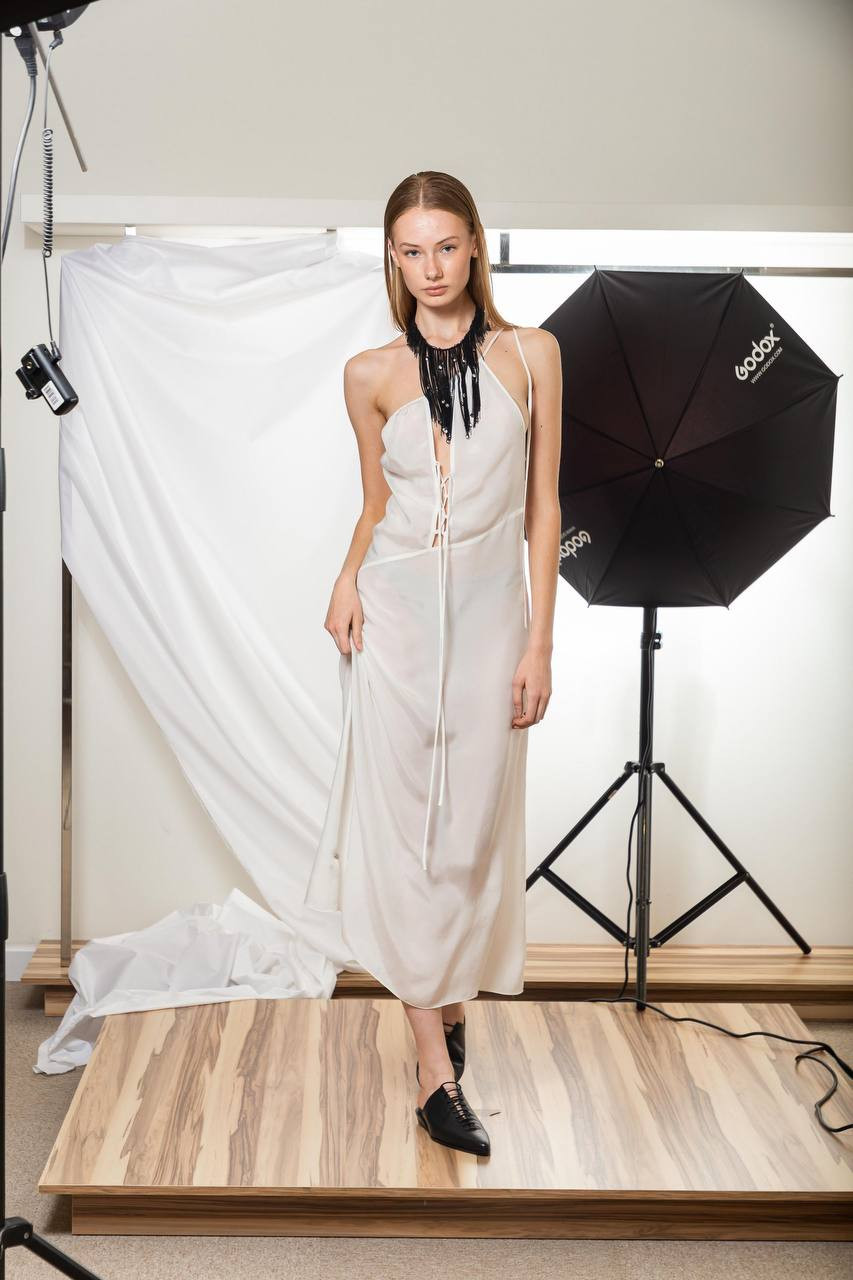 White lace-up asymmetric midi dress Materiel
White lace-up asymmetric midi dress Materiel