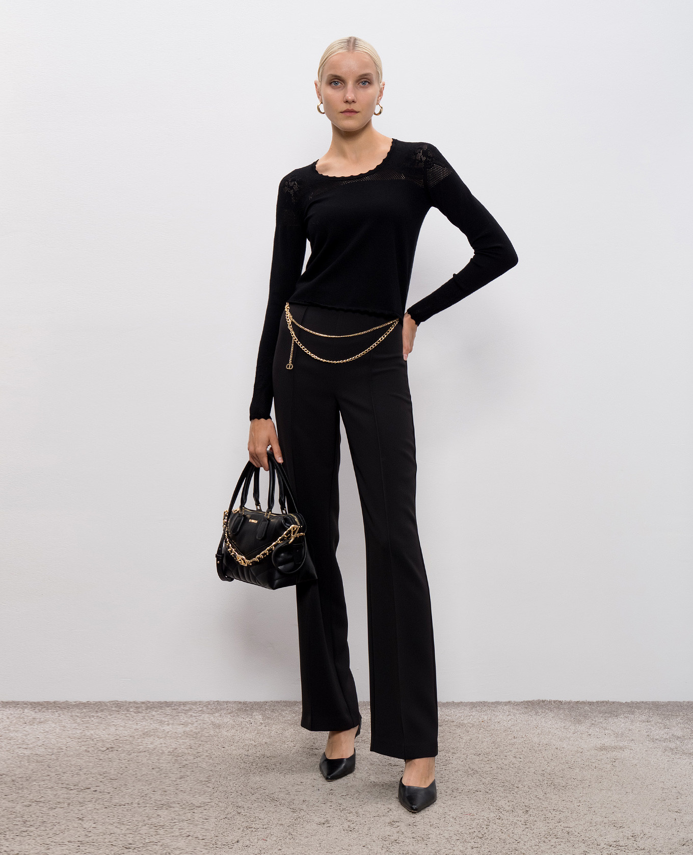 Black flared pants with chain Twinset
Black flared pants with chain Twinset