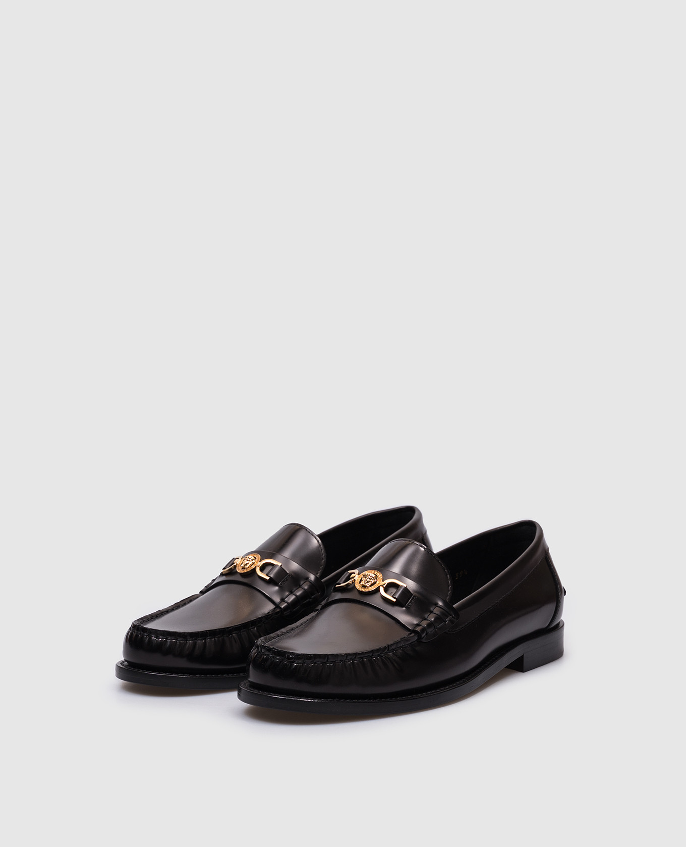

Black leather loafers with metal Medusa emblem Versace