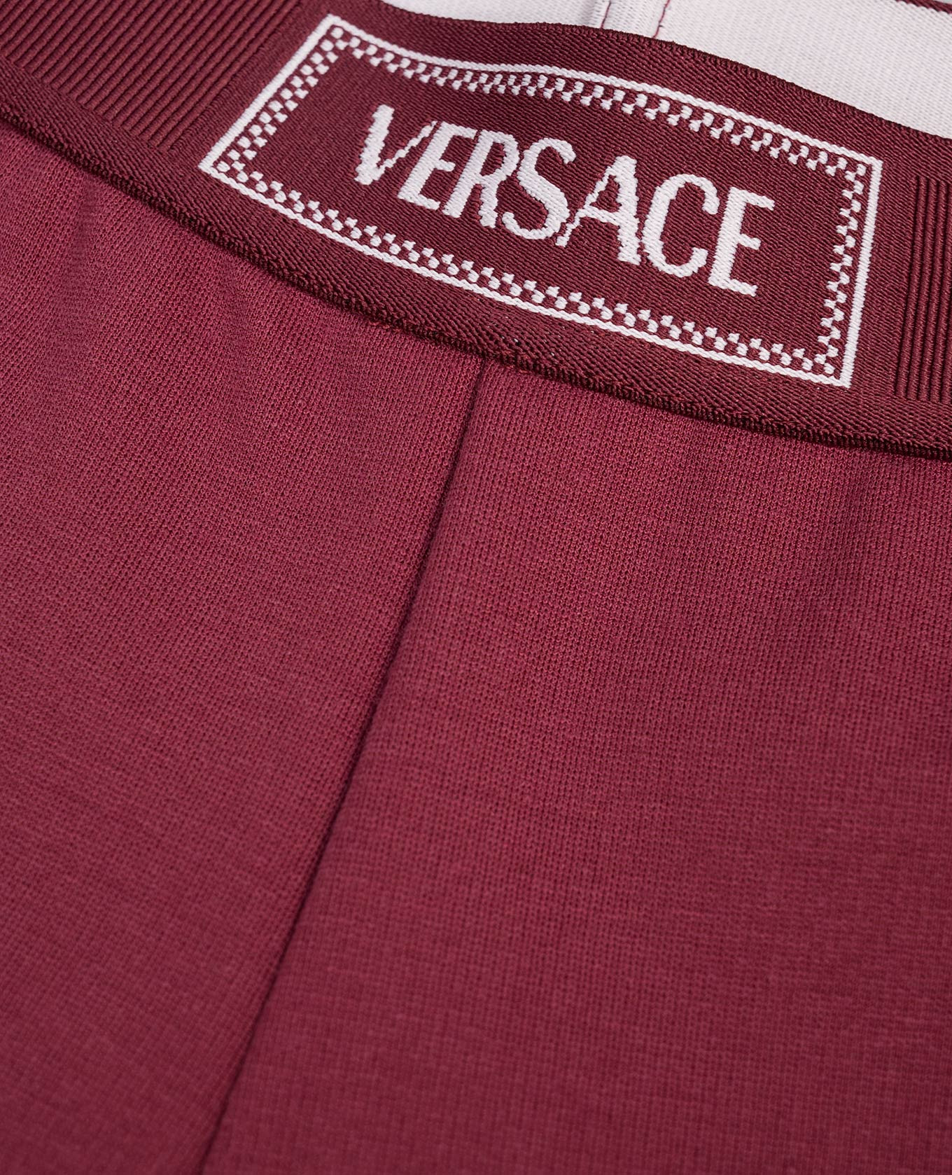 

Children's burgundy leggings with logo Versace