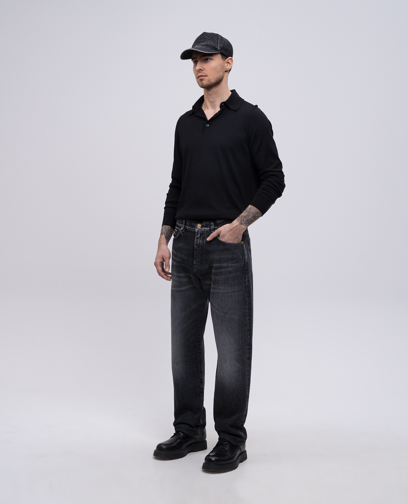 

Black jeans with leather logo patch Versace