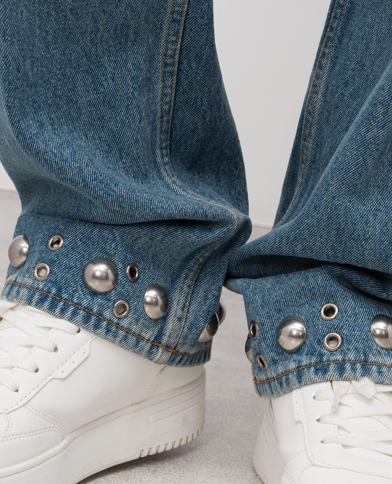 

Blue jeans with eyelets Valentino
