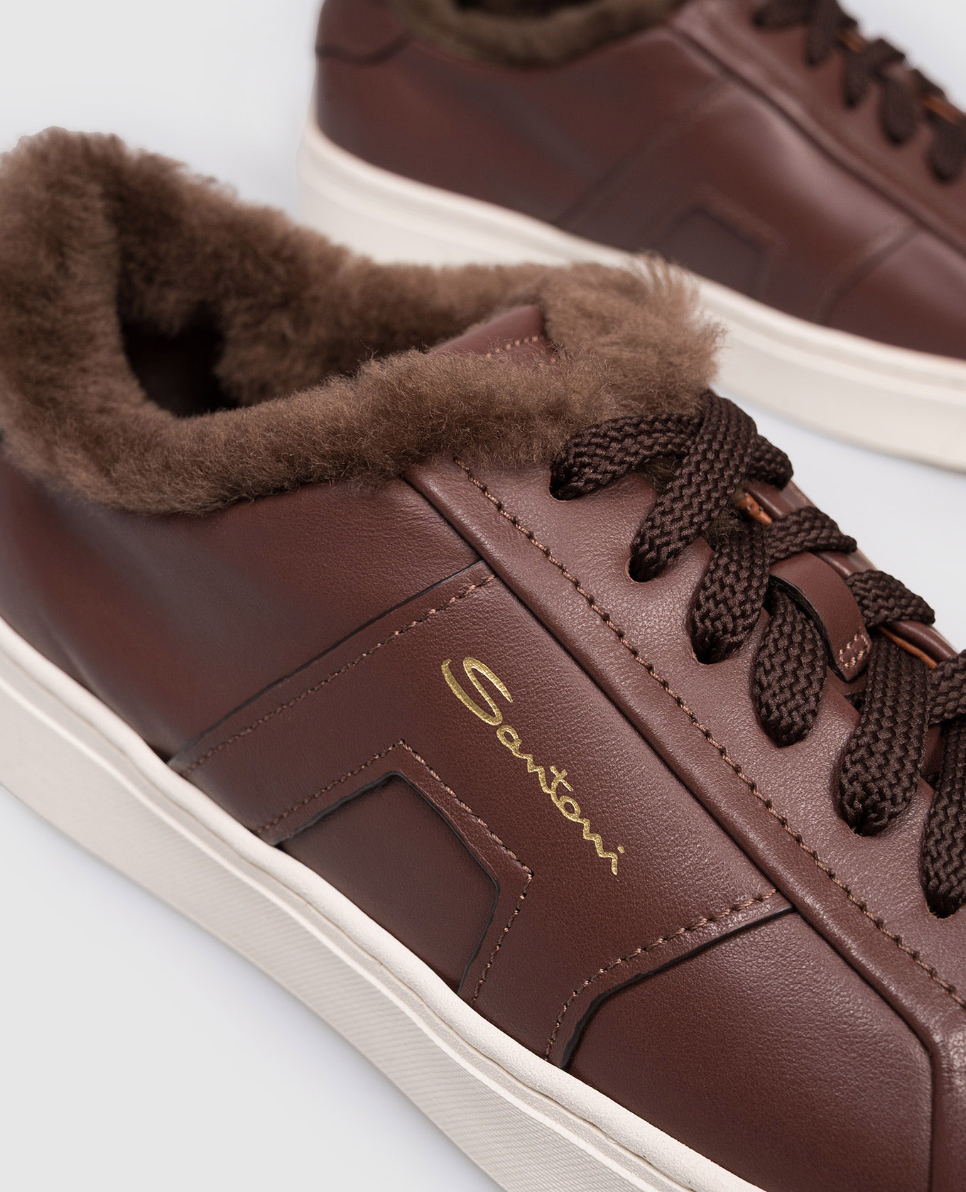 

Brown leather sneakers with fur and logo Santoni