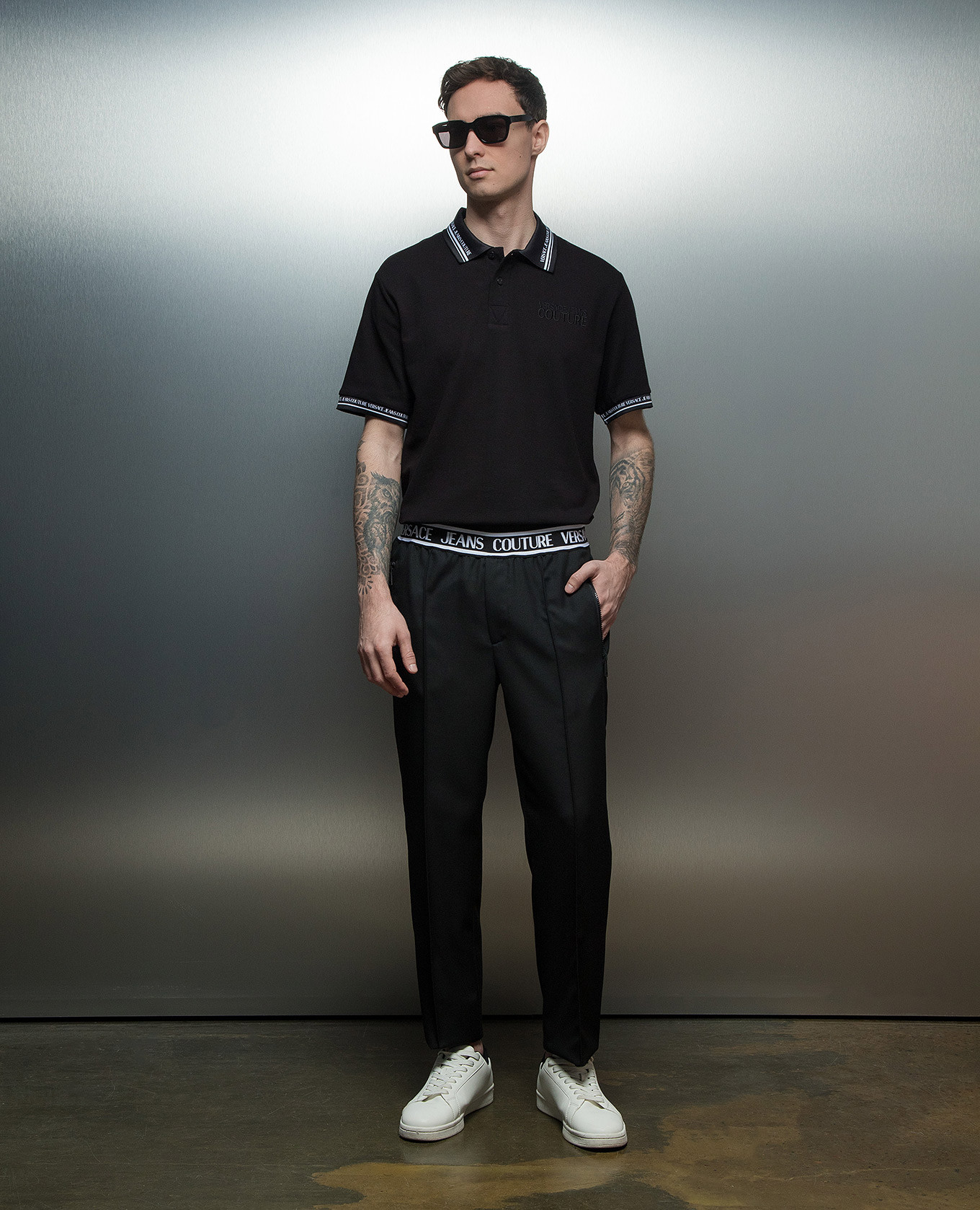 

Black pants with a logo pattern Versace Jeans Couture
