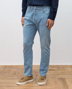 Brunello Cucinelli Blue jeans with leather logo patch M283PX1290