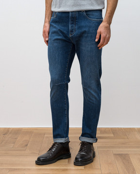 Brunello Cucinelli Blue jeans with leather logo patch M283PX1290