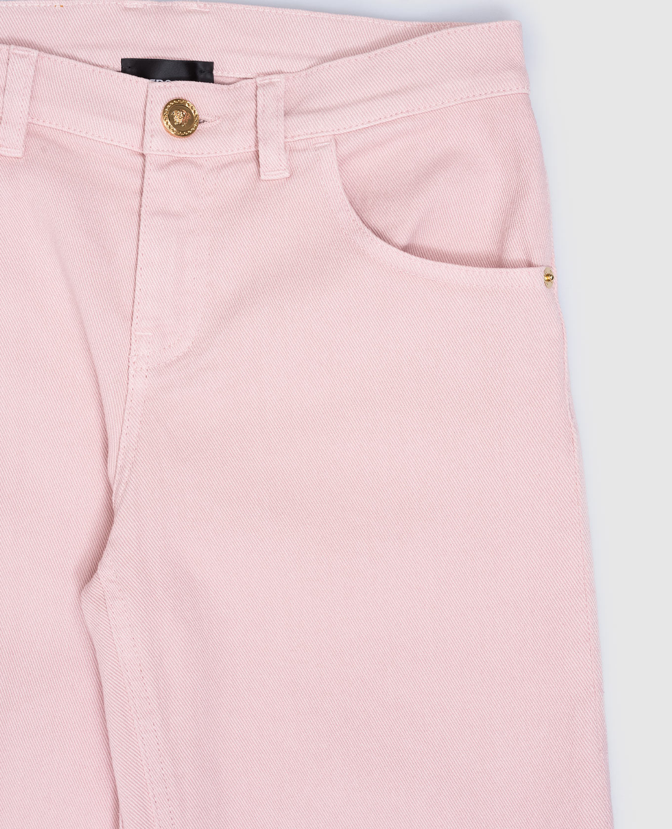 

Baby pink jeans with logo patch Versace