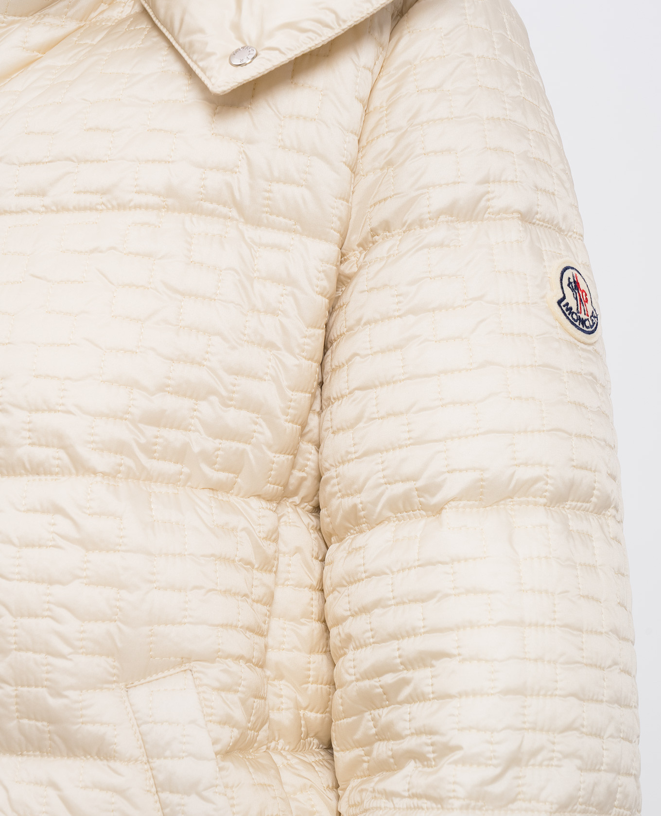 

Beige quilted down jacket with logo patch Moncler