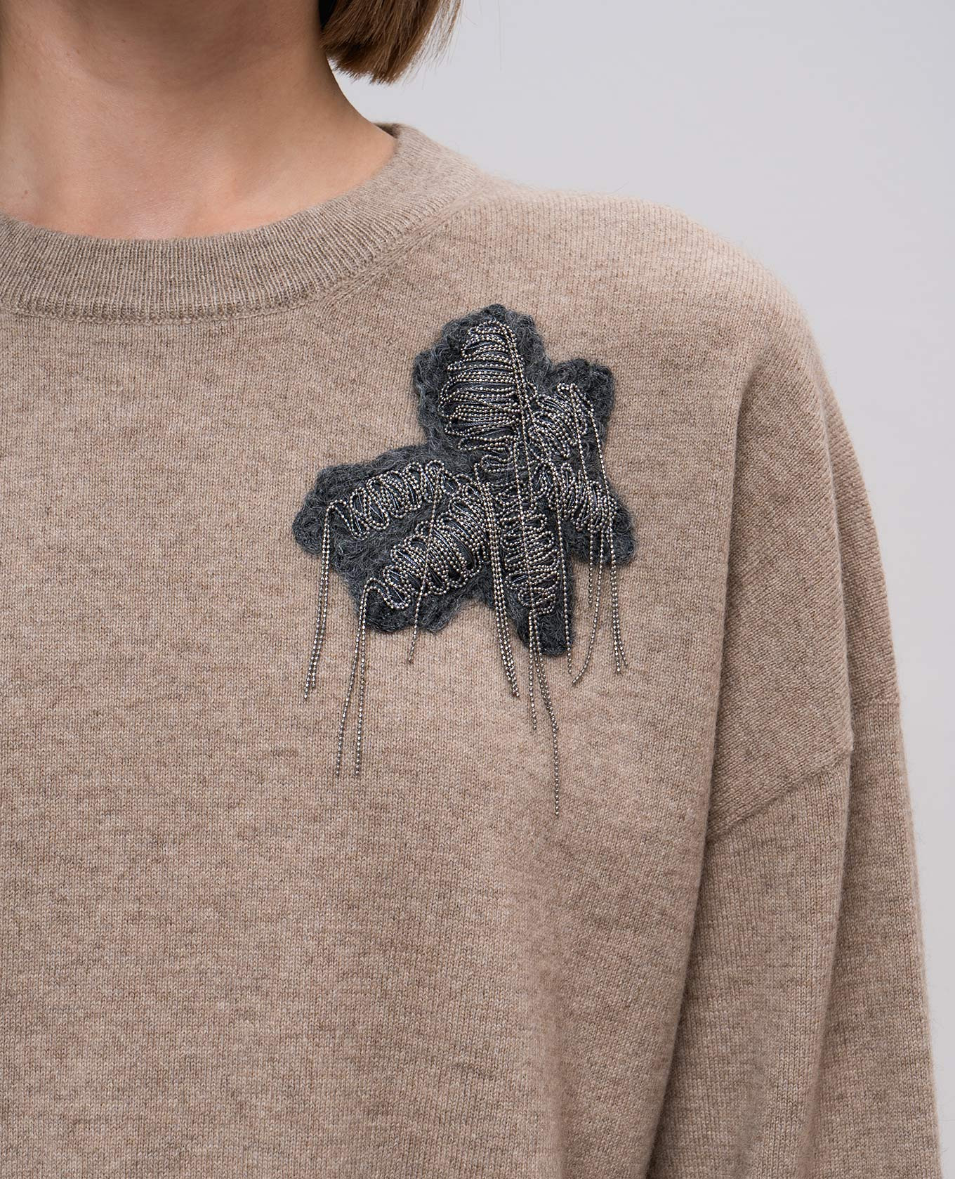 

Brown jumper with appliqué in the form of a flower Brunello Cucinelli