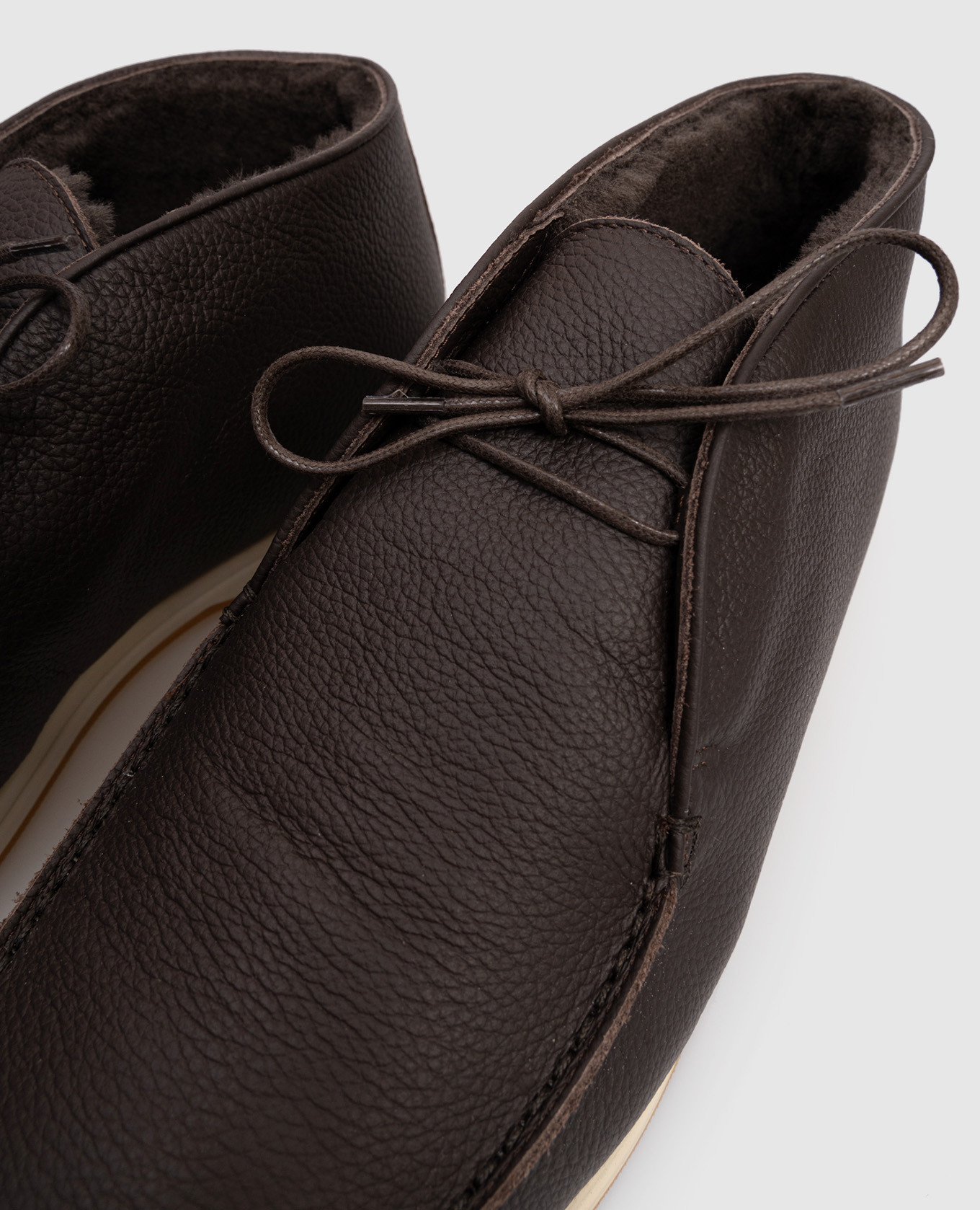 

Brown leather deserts on fur Enrico Mandelli