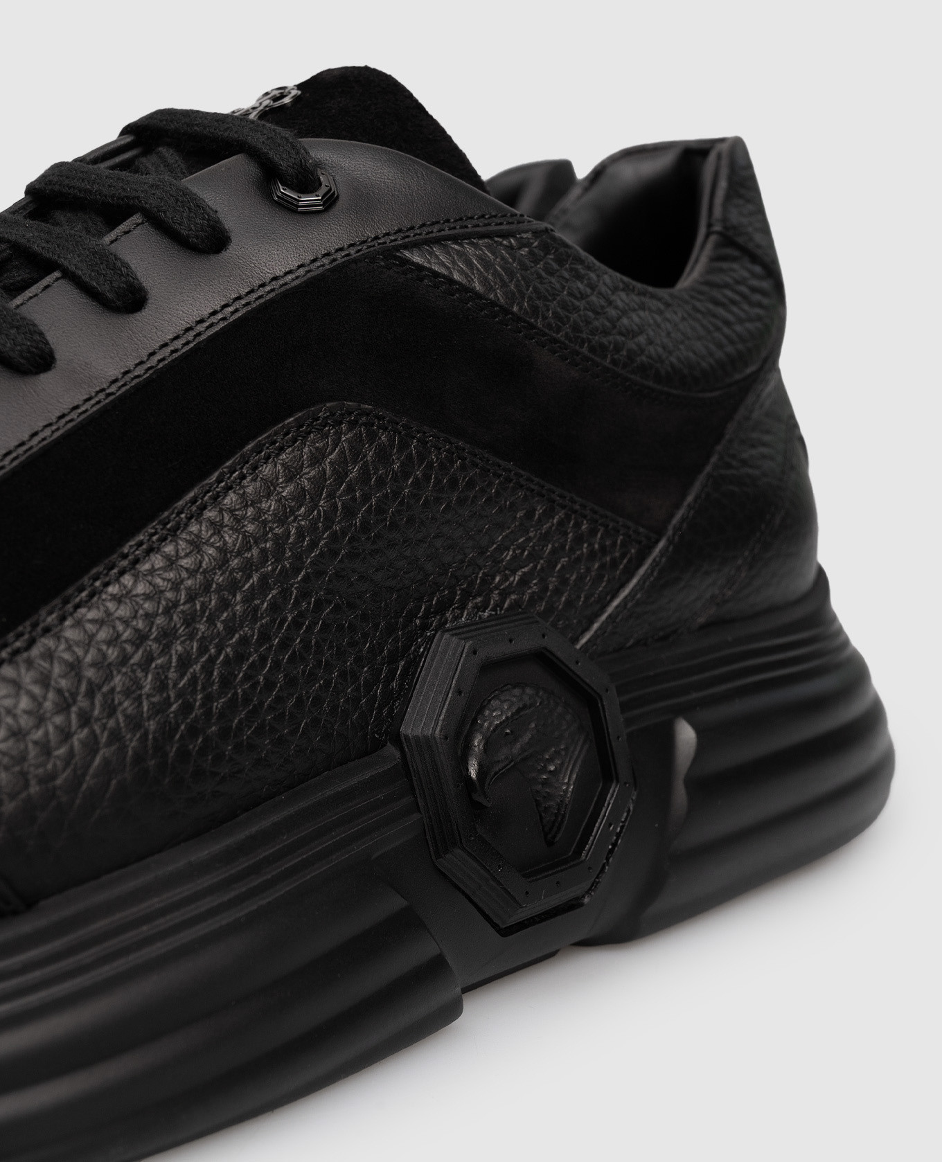 

Black leather sneakers with textured emblem Stefano Ricci