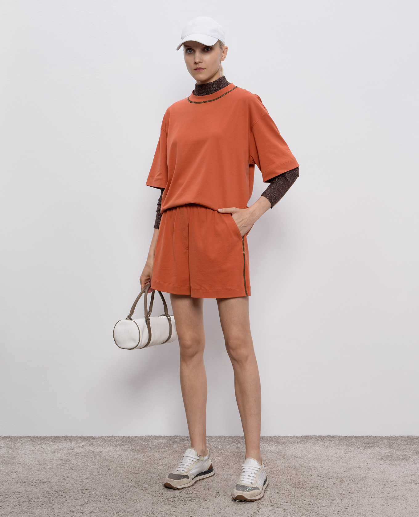 

Orange shorts with monil chain Brunello Cucinelli