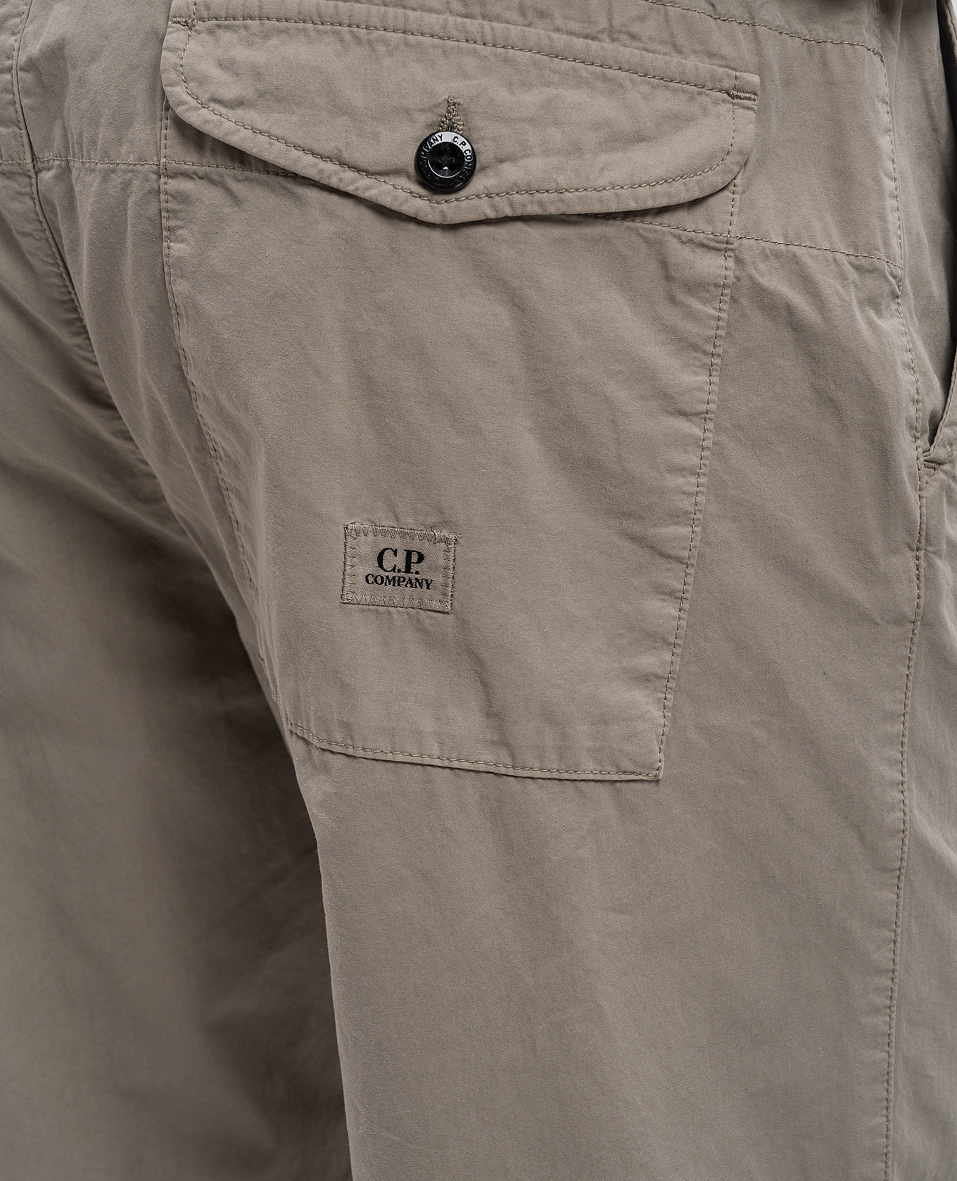 

Beige pants with logo patch C.P. Company