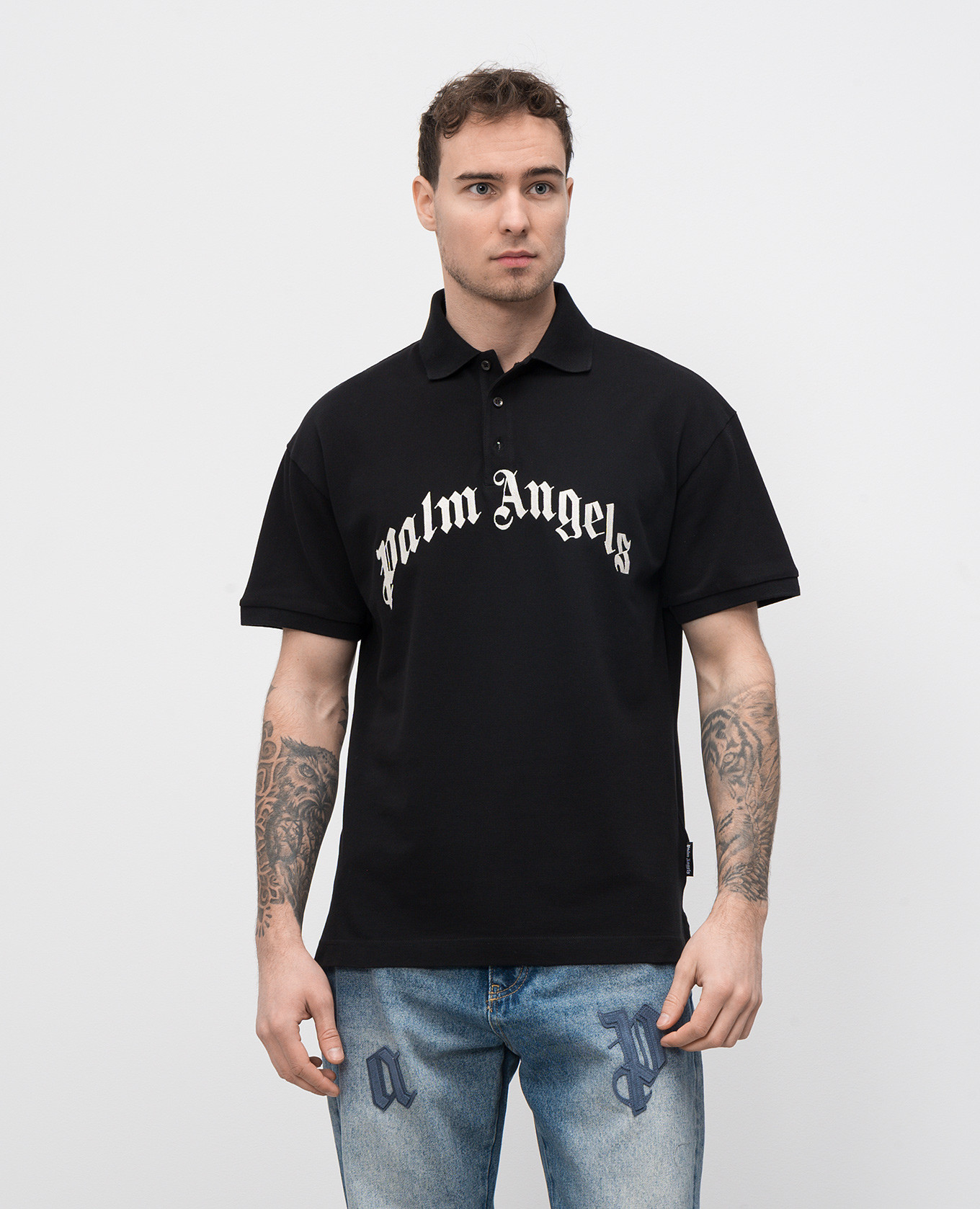 

Black polo shirt with embroidered logo Palm Angels