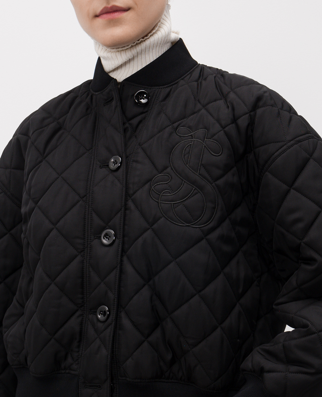 

Black quilted bomber jacket with embroidered monogram logo Jil Sander
