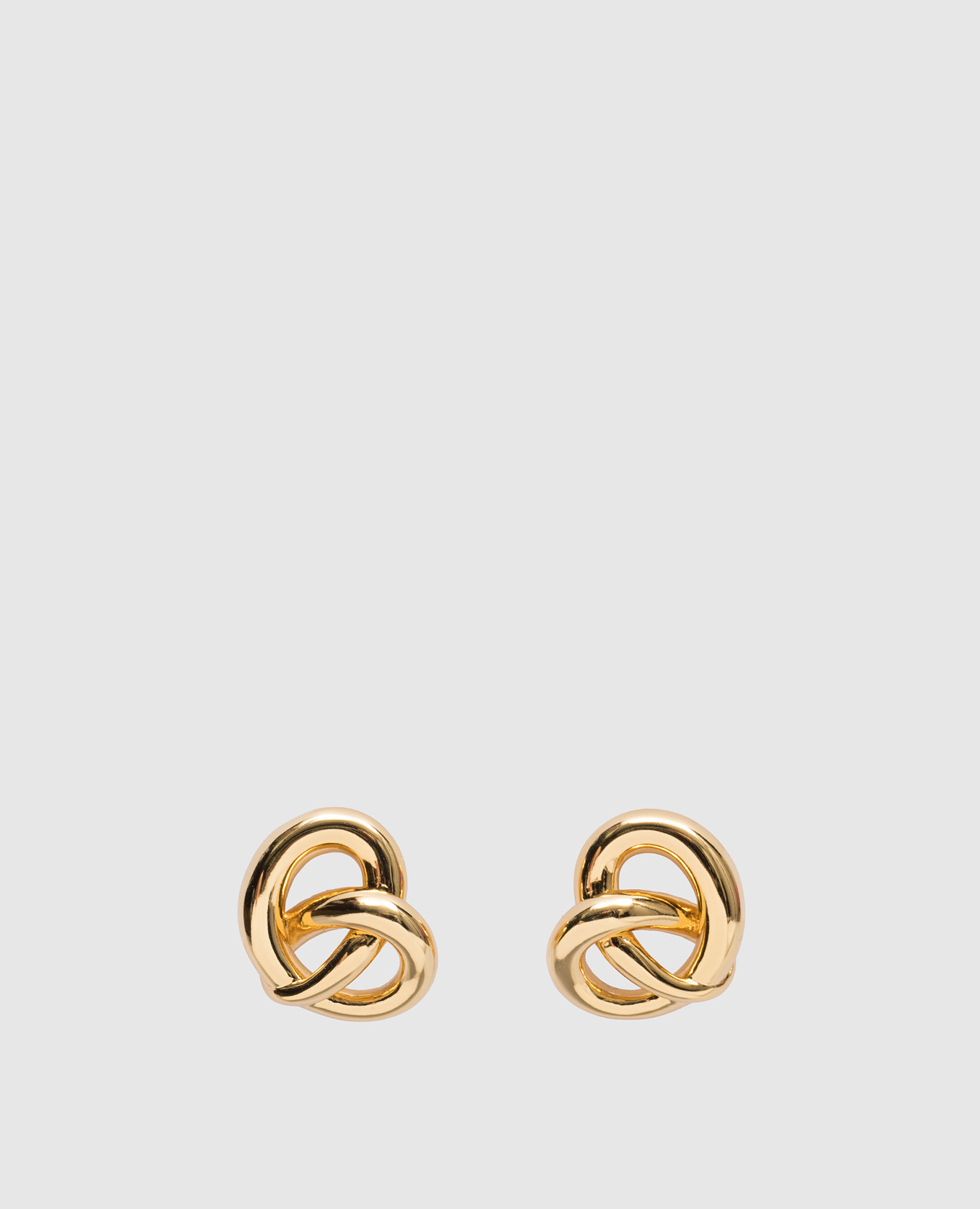 

Golden earrings in the form of a knot LELET NY