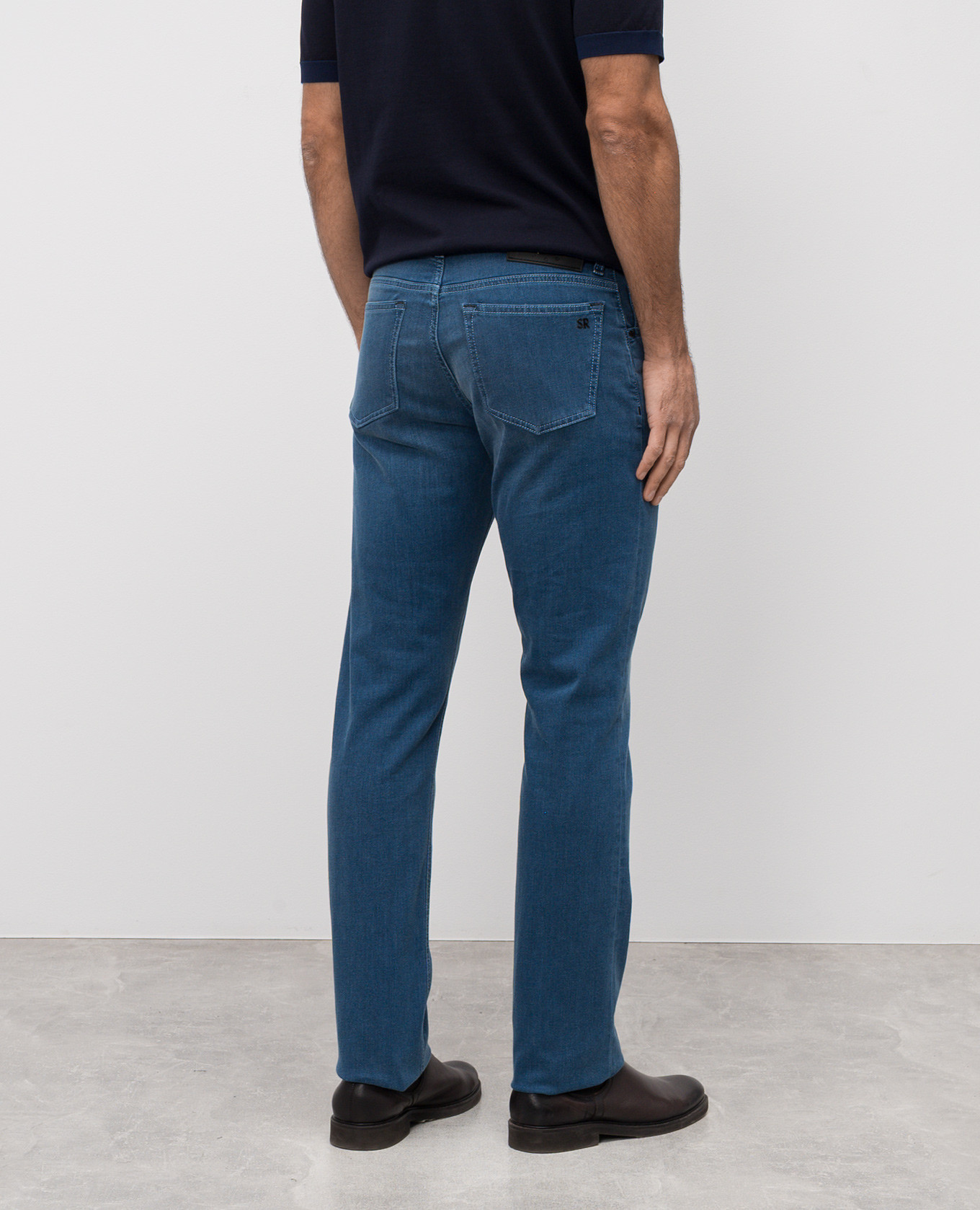 

Blue jeans with leather logo patch Stefano Ricci