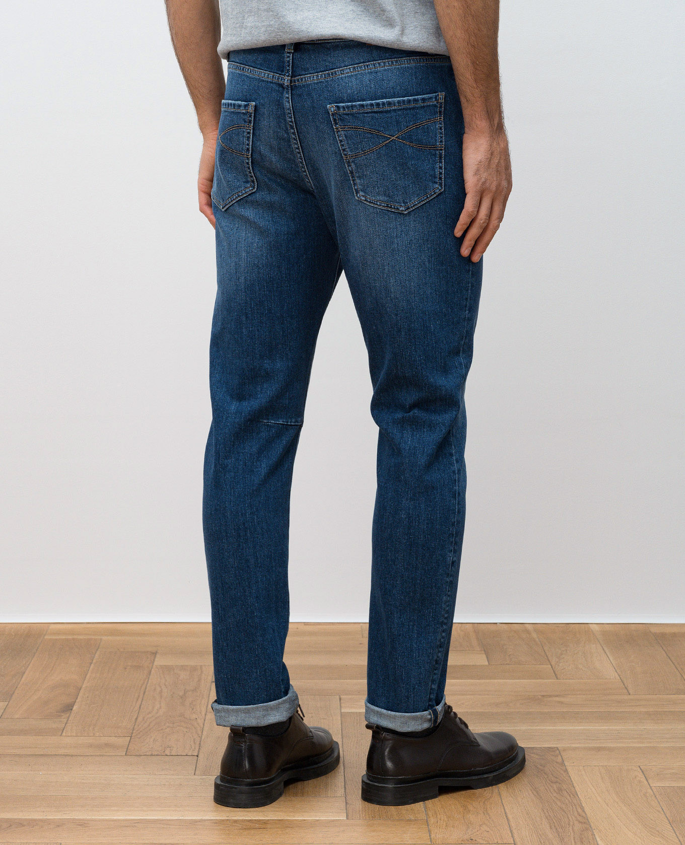

Blue jeans with leather logo patch Brunello Cucinelli