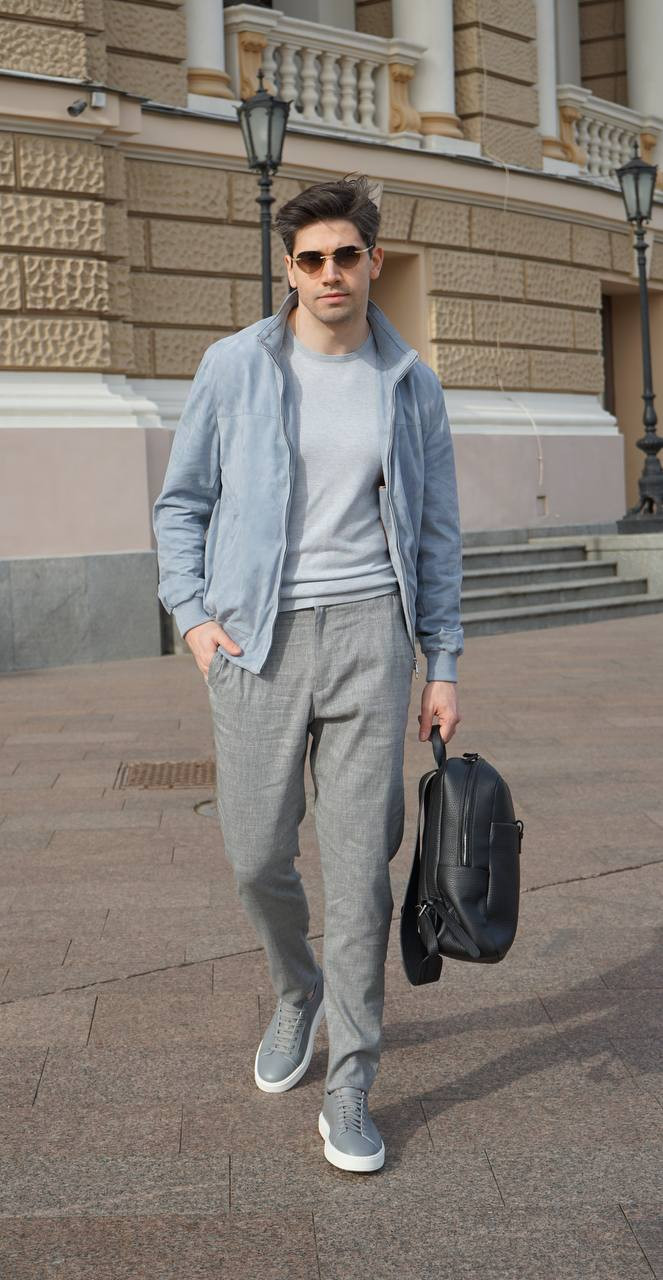 

Grey silk T-shirt with metal logo plate Enrico Mandelli