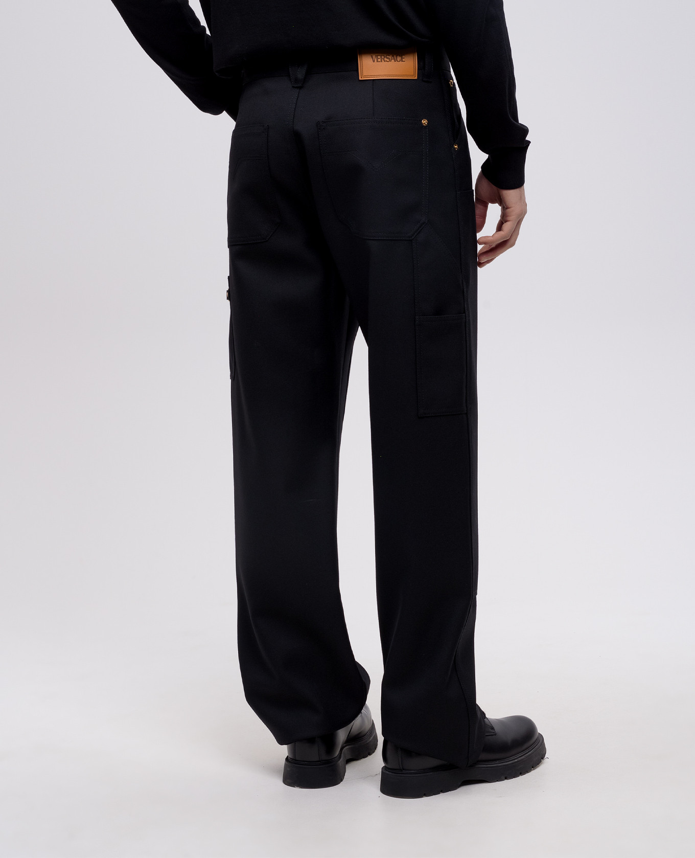 Black wool trousers with leather logo patch Versace 4
