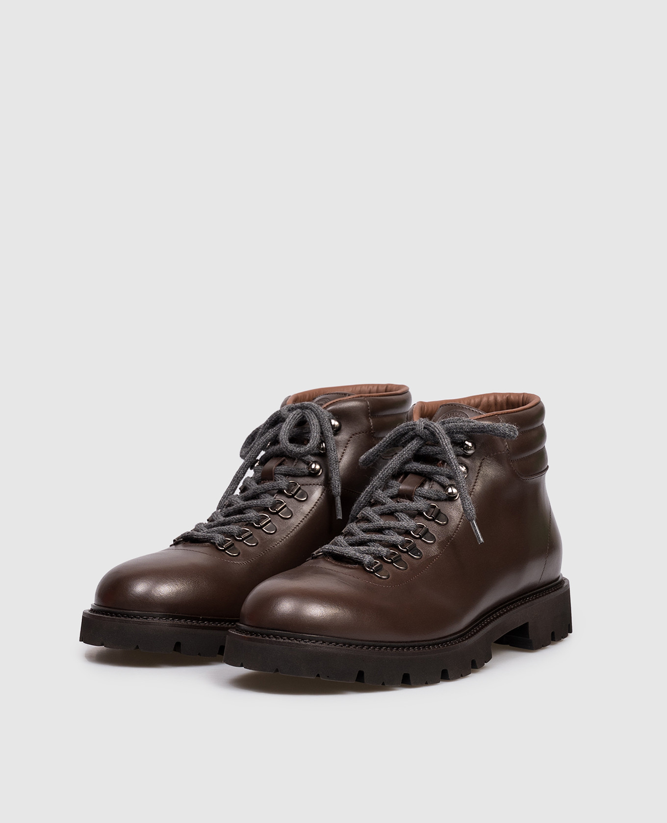 

Brown leather boots with emblem Peserico