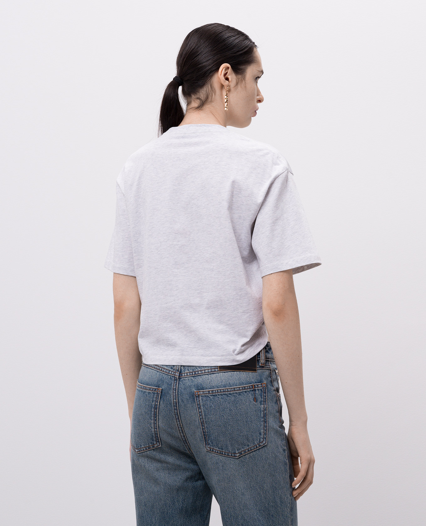 

Grey cropped T-shirt with logo and branded pin Versace