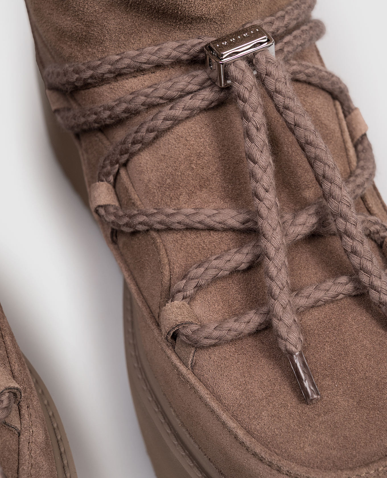

Brown suede boots with fur trim and logo embroidery Inuikii