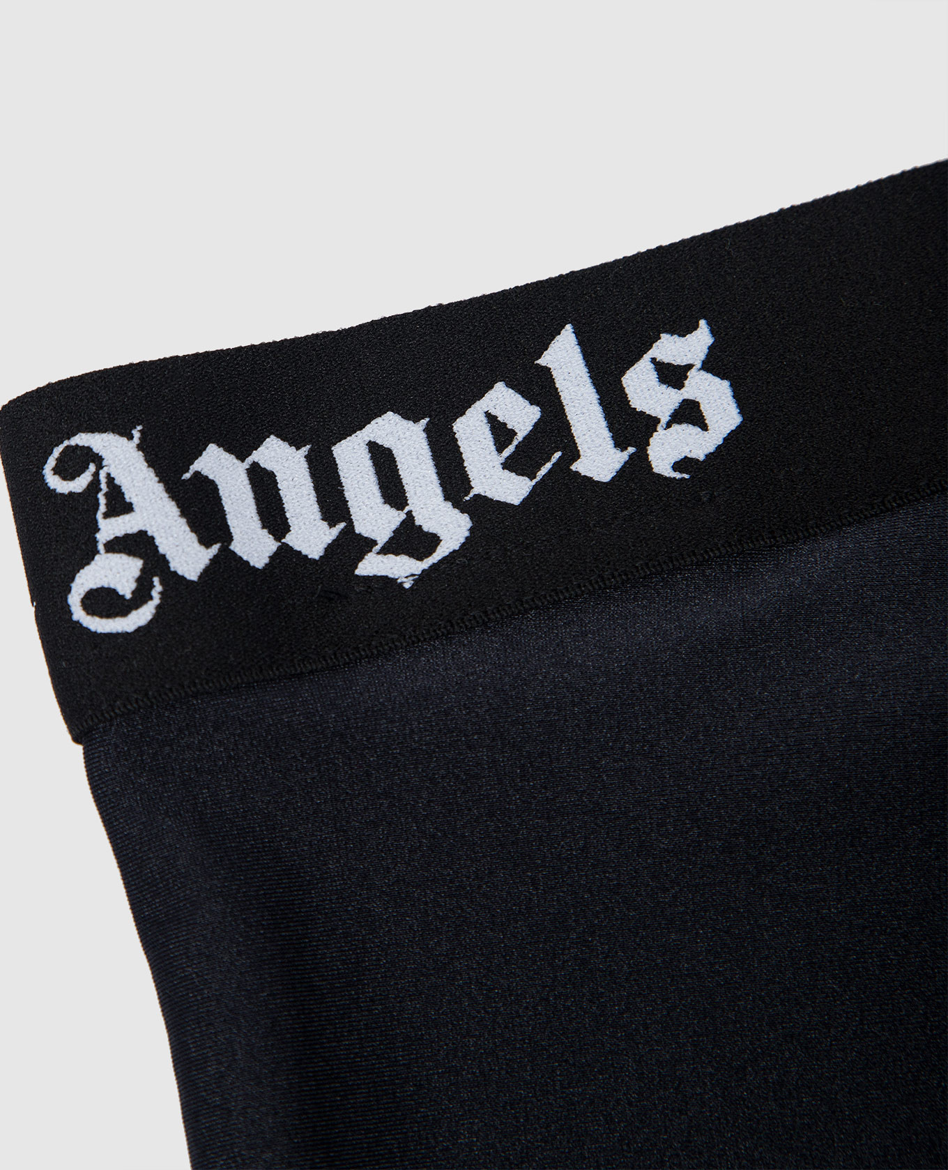 

Children's black leggings with a logo pattern Palm Angels
