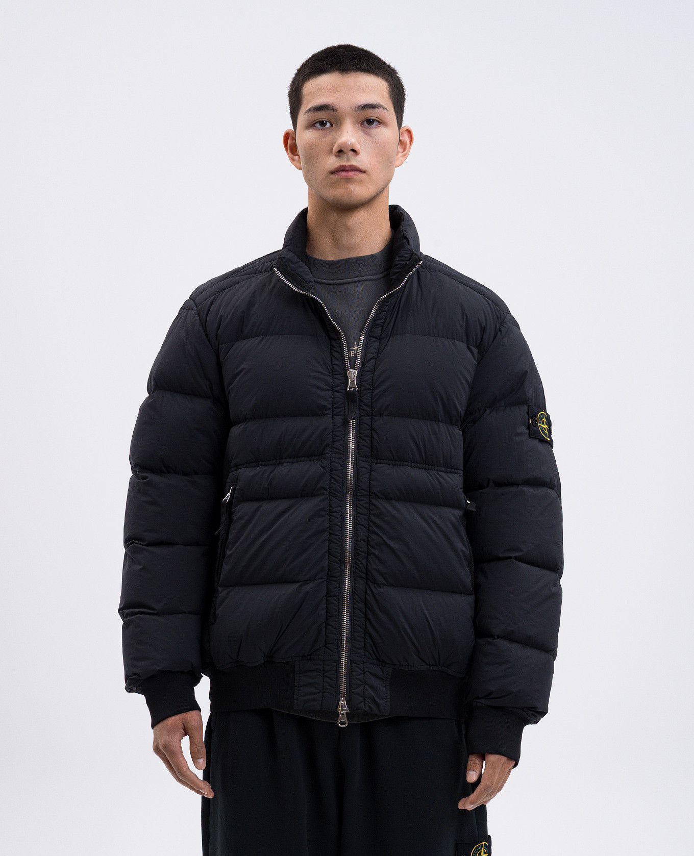 

Black down jacket with logo Stone Island