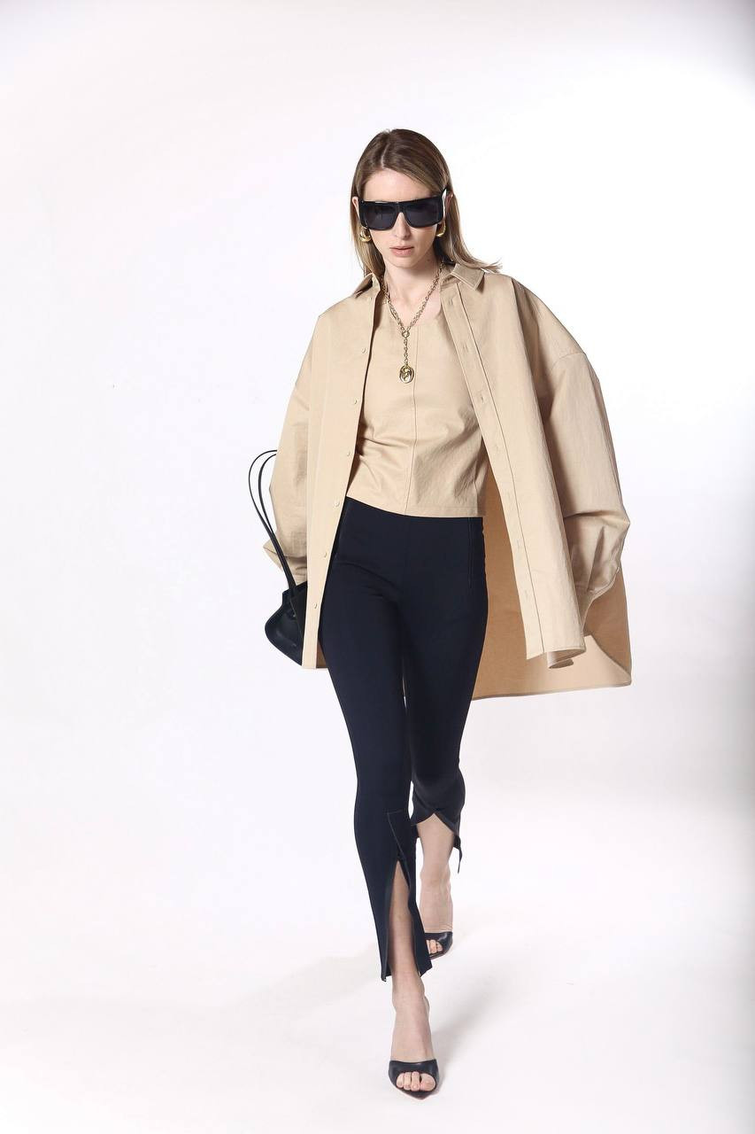 

Beige top with an open back WARDROBE.NYC