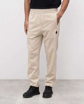 Moncler Beige joggers with logo patch K20918H0000289AZY