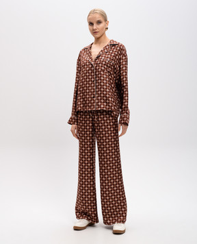AMIRI Brown flared silk trousers with logo monogram print AWPACA1014