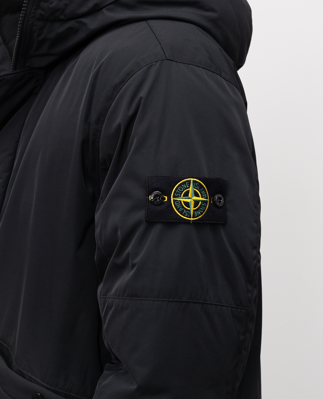 

Black down jacket with logo Stone Island
