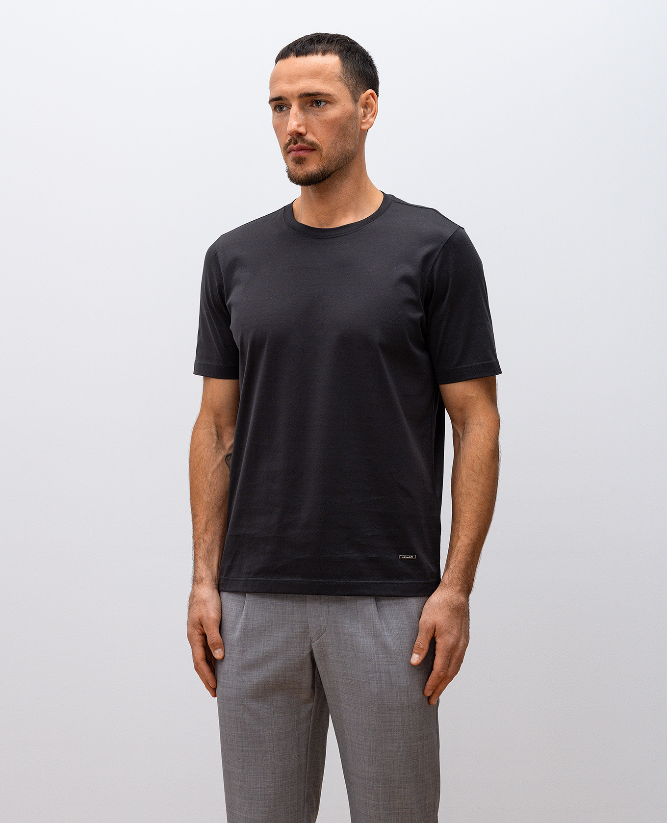 

Grey T-shirt with metal logo plate Enrico Mandelli