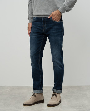 Brunello Cucinelli Blue jeans with a distressed effect and a logo patch M283PD3210