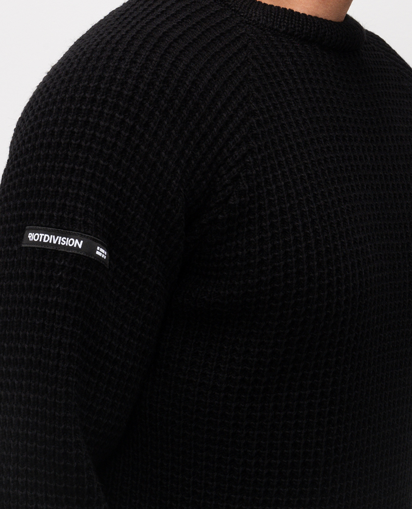 

Black wool sweater with logo Riotdivision