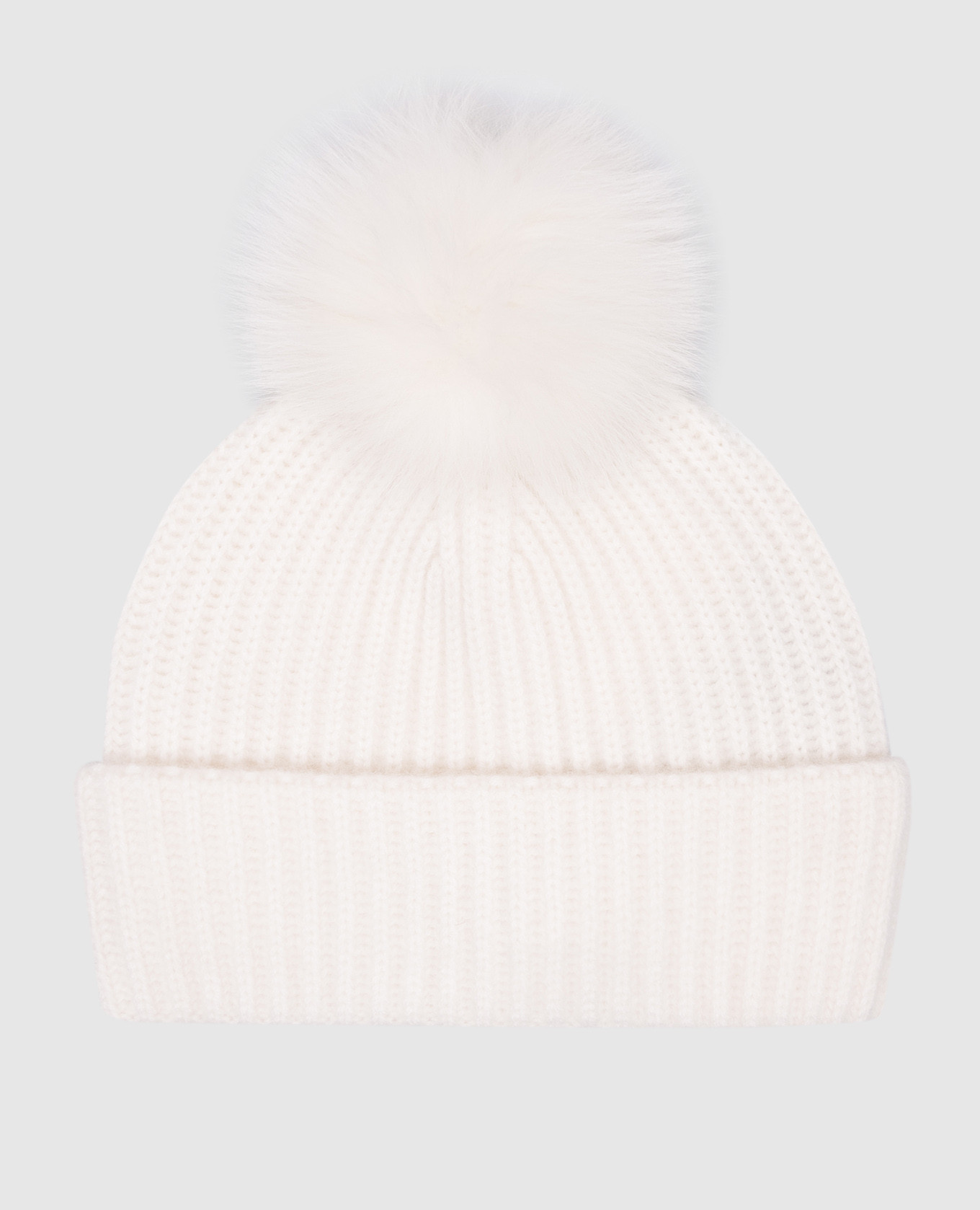

A white cashmere hat with a fur pom-pom Yves Salomon
