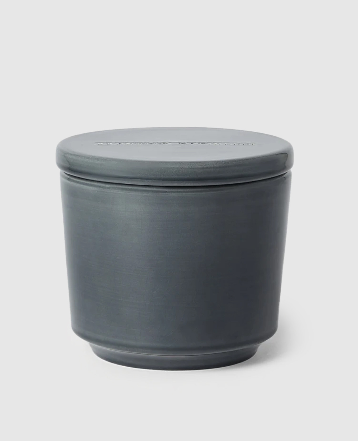 

A candle in a ceramic candle holder with the aroma of white tea Brunello Cucinelli, Grey