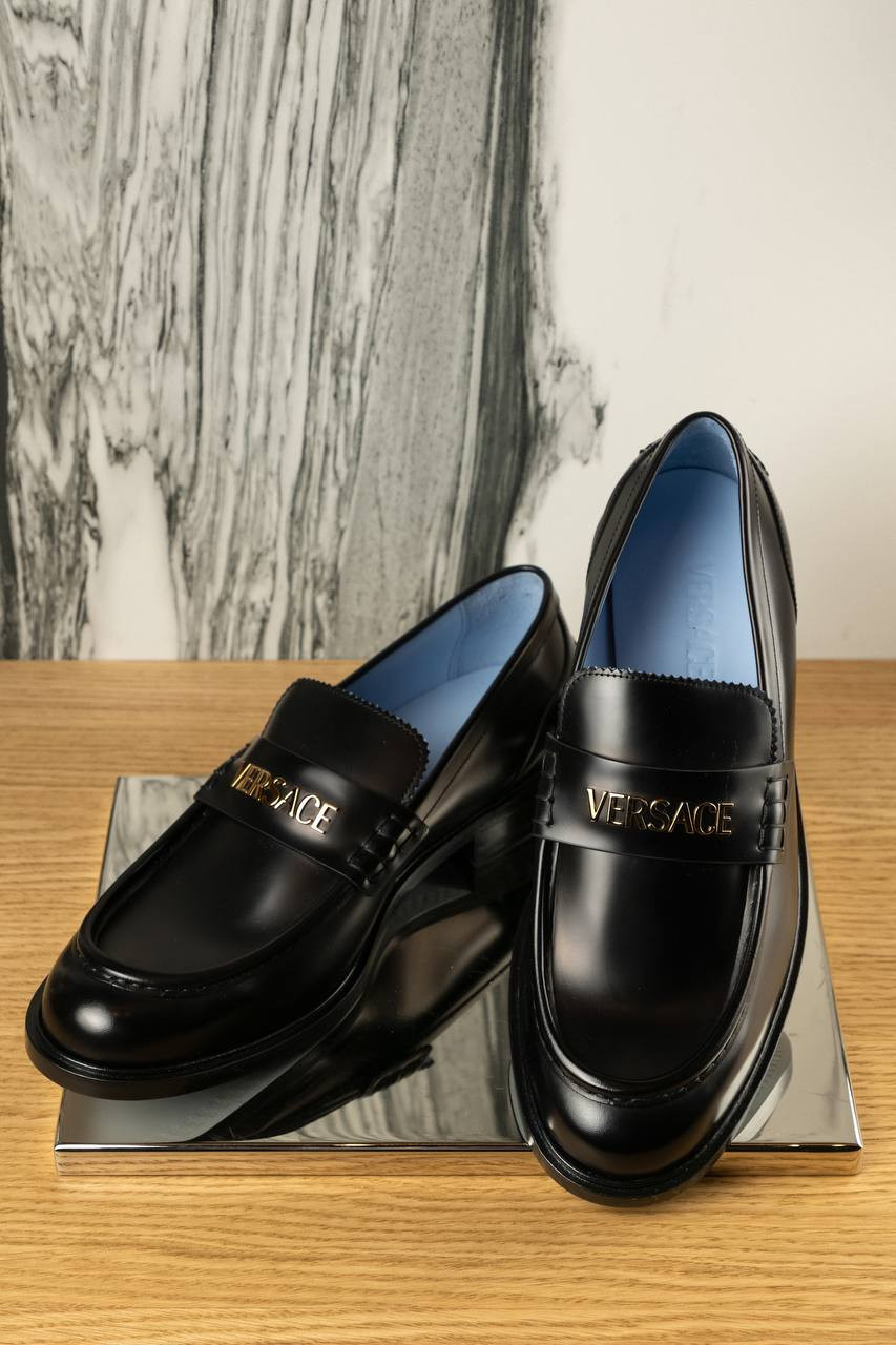 

Black leather glossy loafers with metal logo Versace