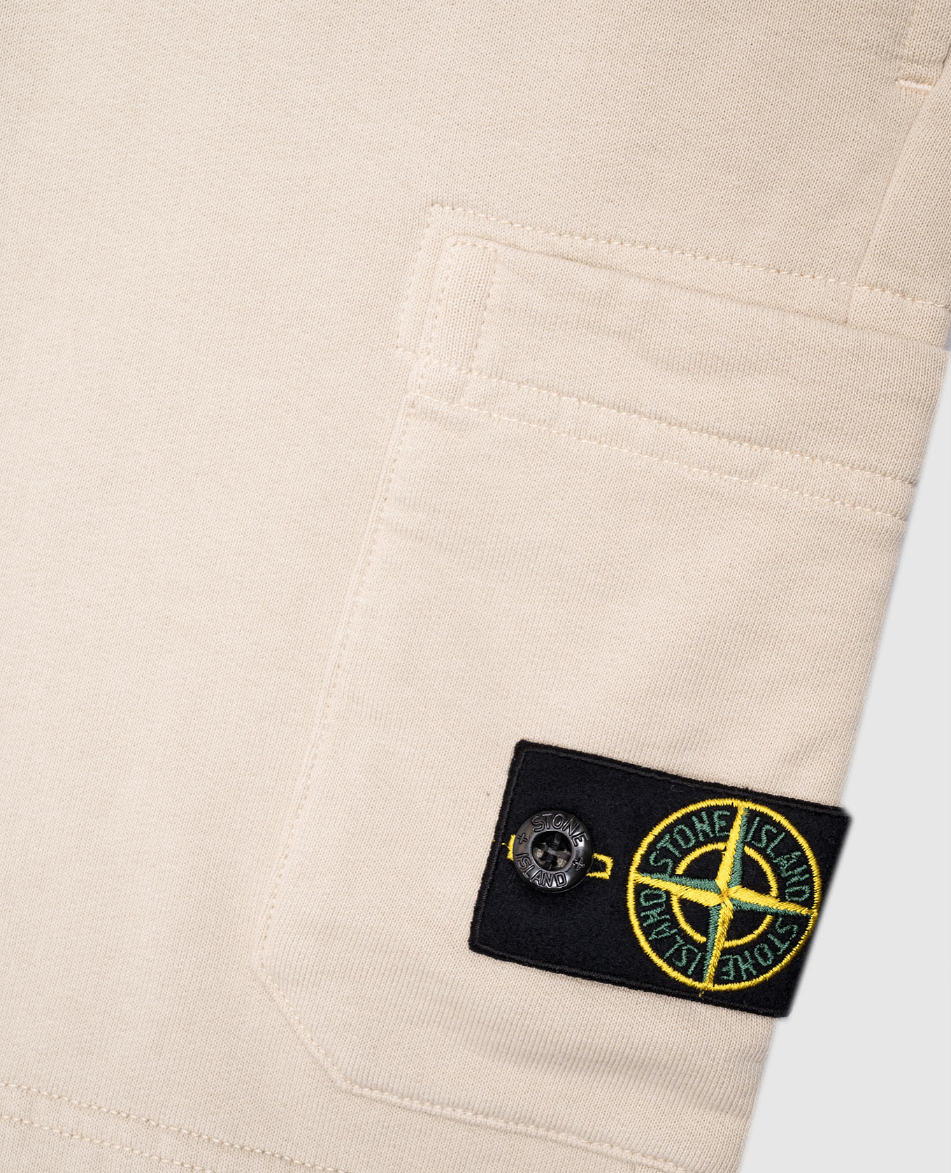 

Children's beige shorts with patch Stone Island