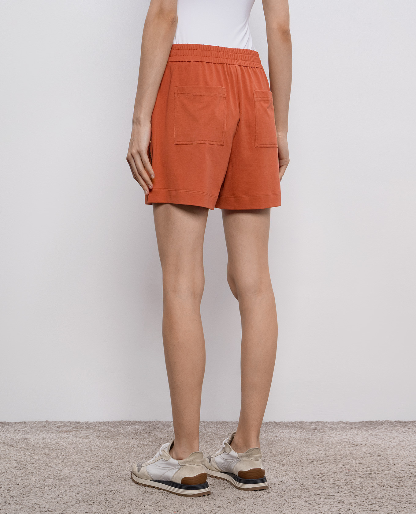 

Orange shorts with monil chain Brunello Cucinelli