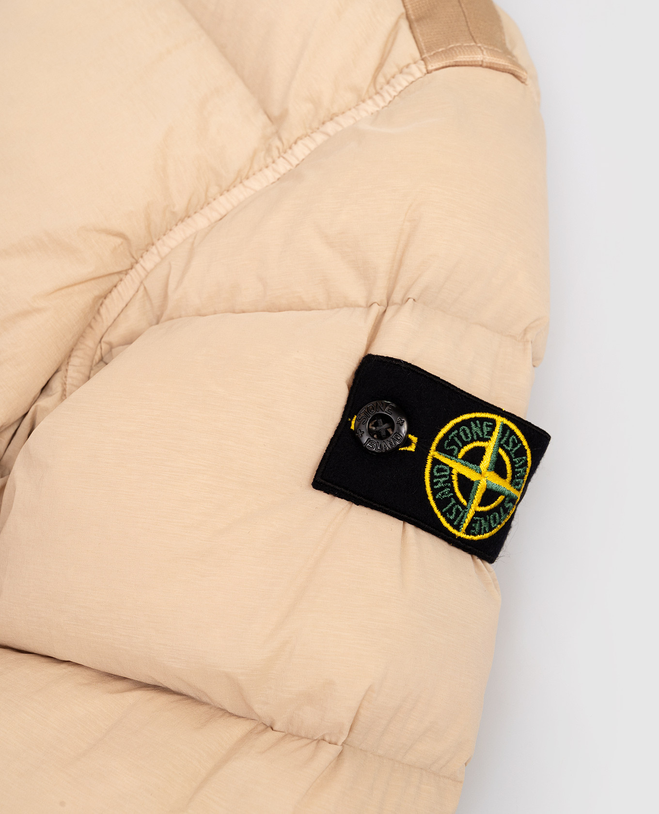 

Children's beige down jacket with logo patch Stone Island