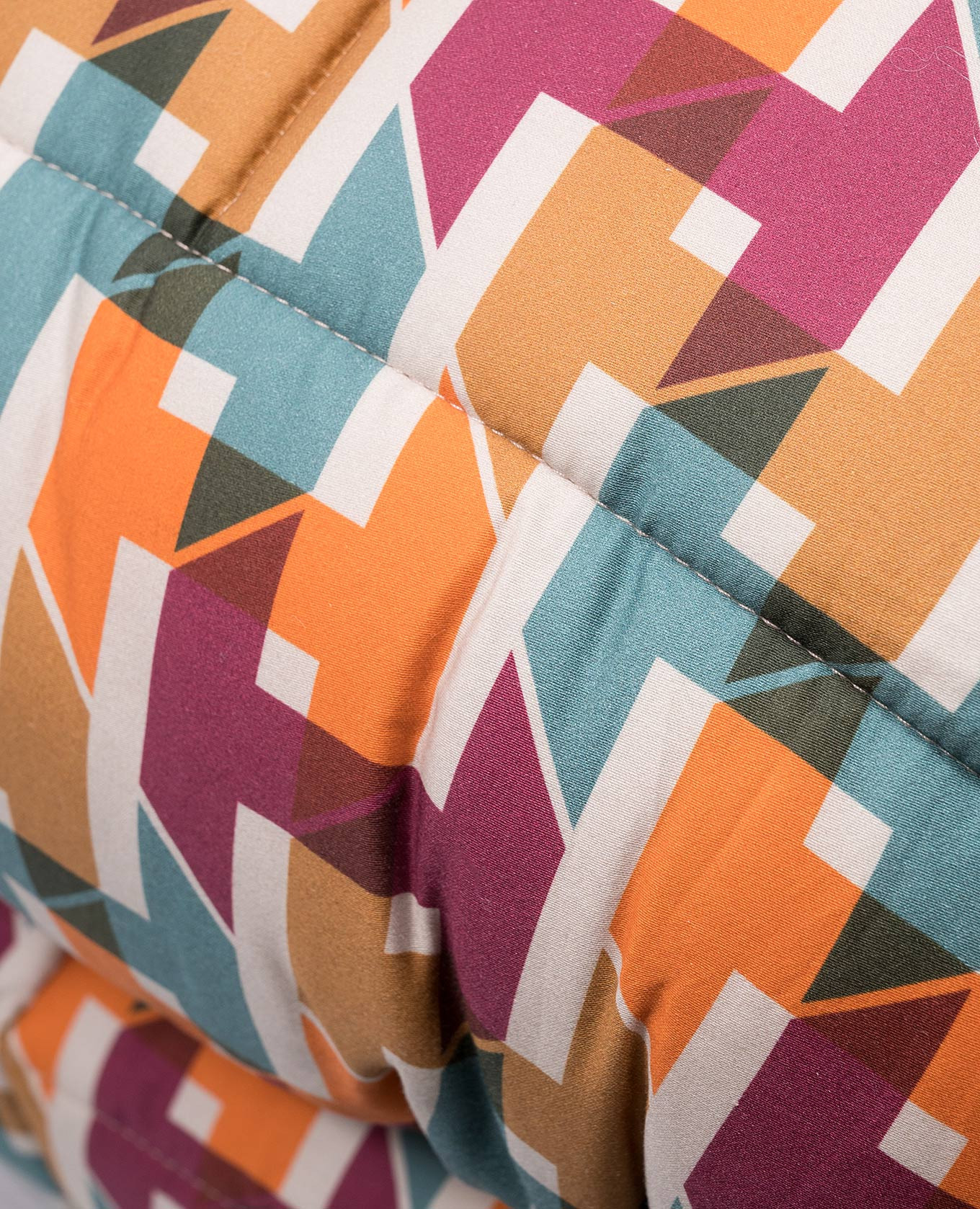 

The blanket is quilted in a geometric pattern Dondi, White