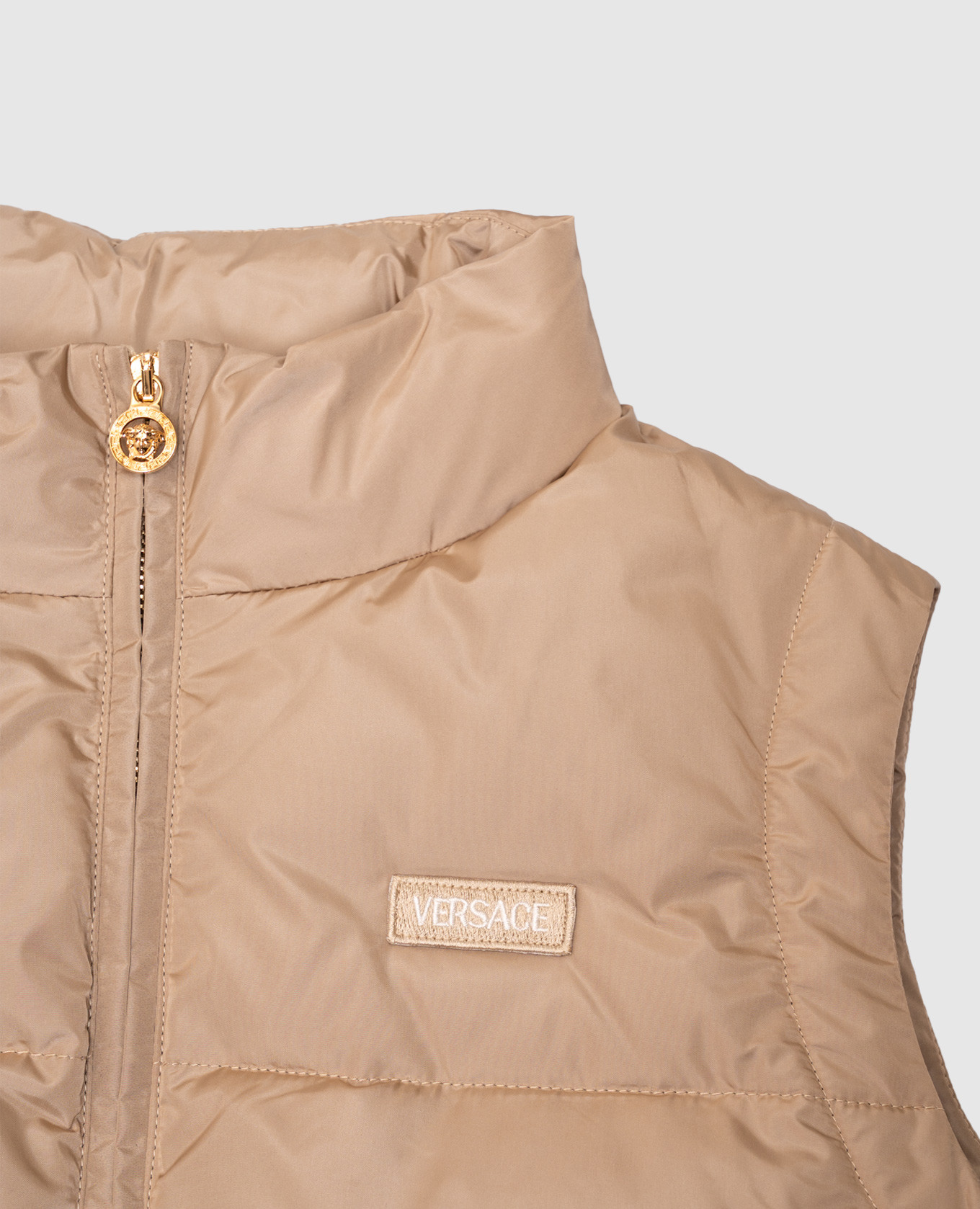 

Children's beige down vest with logo Versace