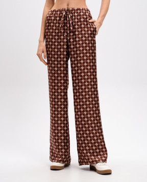 AMIRI Brown flared silk trousers with logo monogram print AWPACA1014