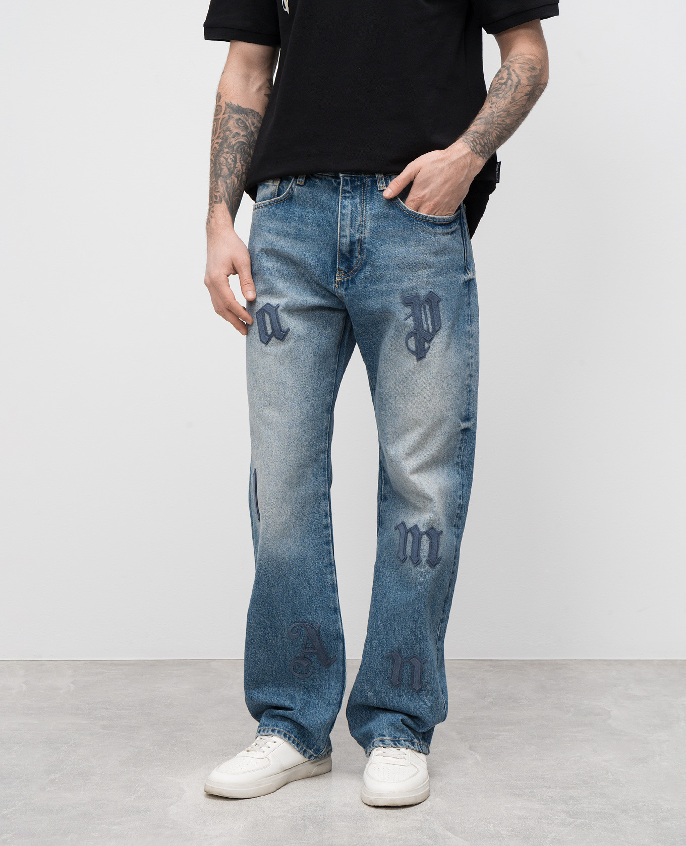 

Blue jeans with suede logo appliqué Palm Angels