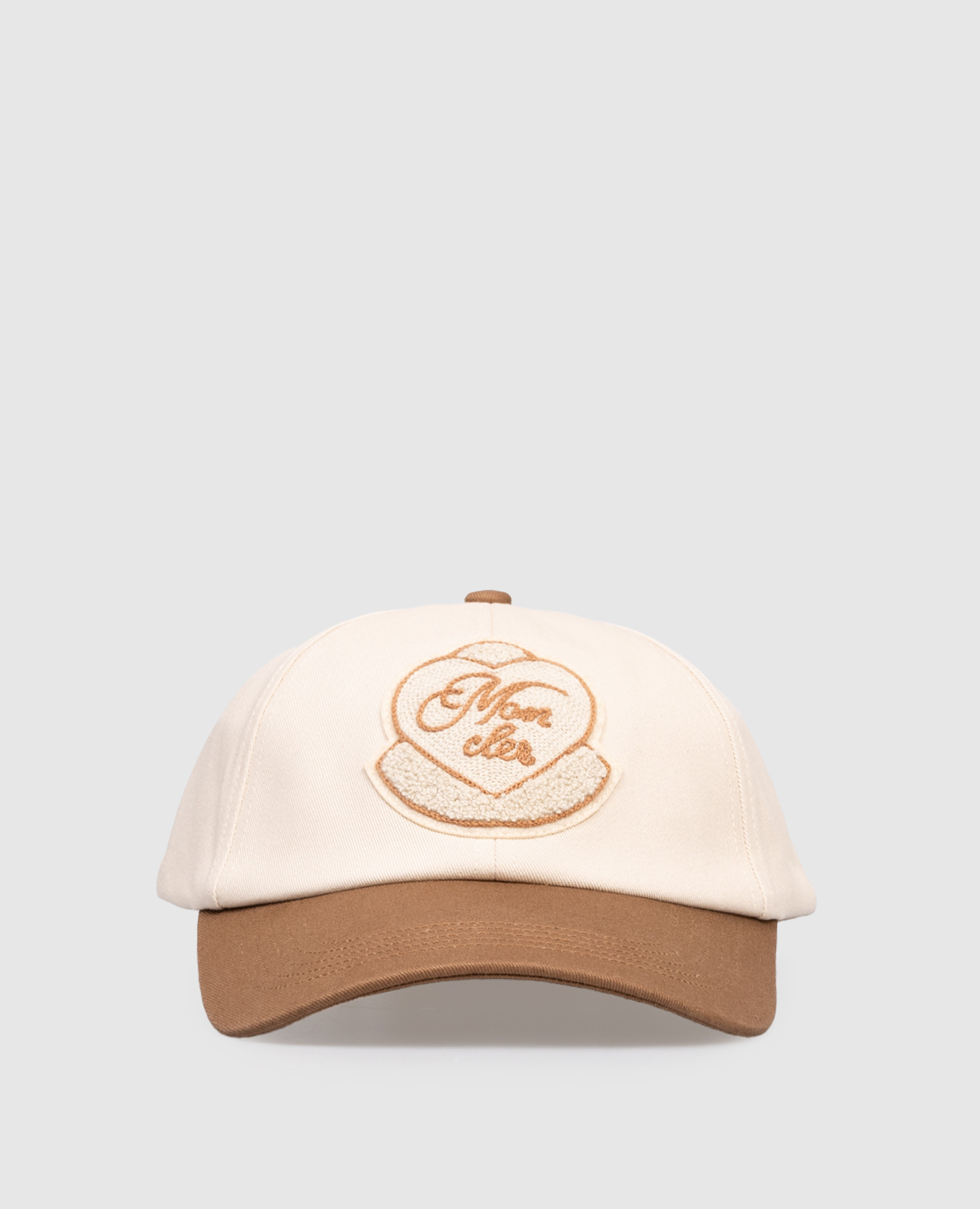 

Beige cap with branded applique Moncler