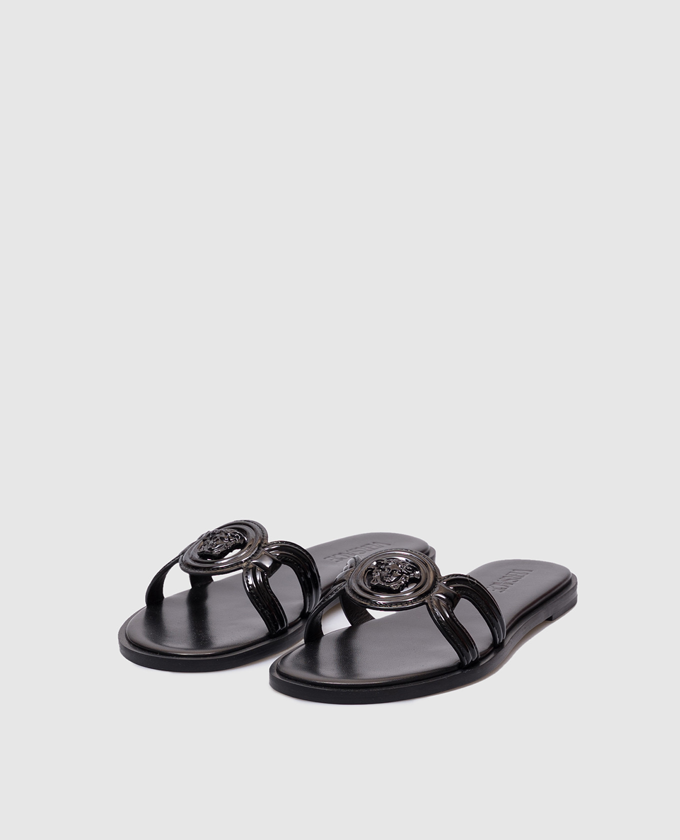 

Black leather flip-flops with logo emblem Versace