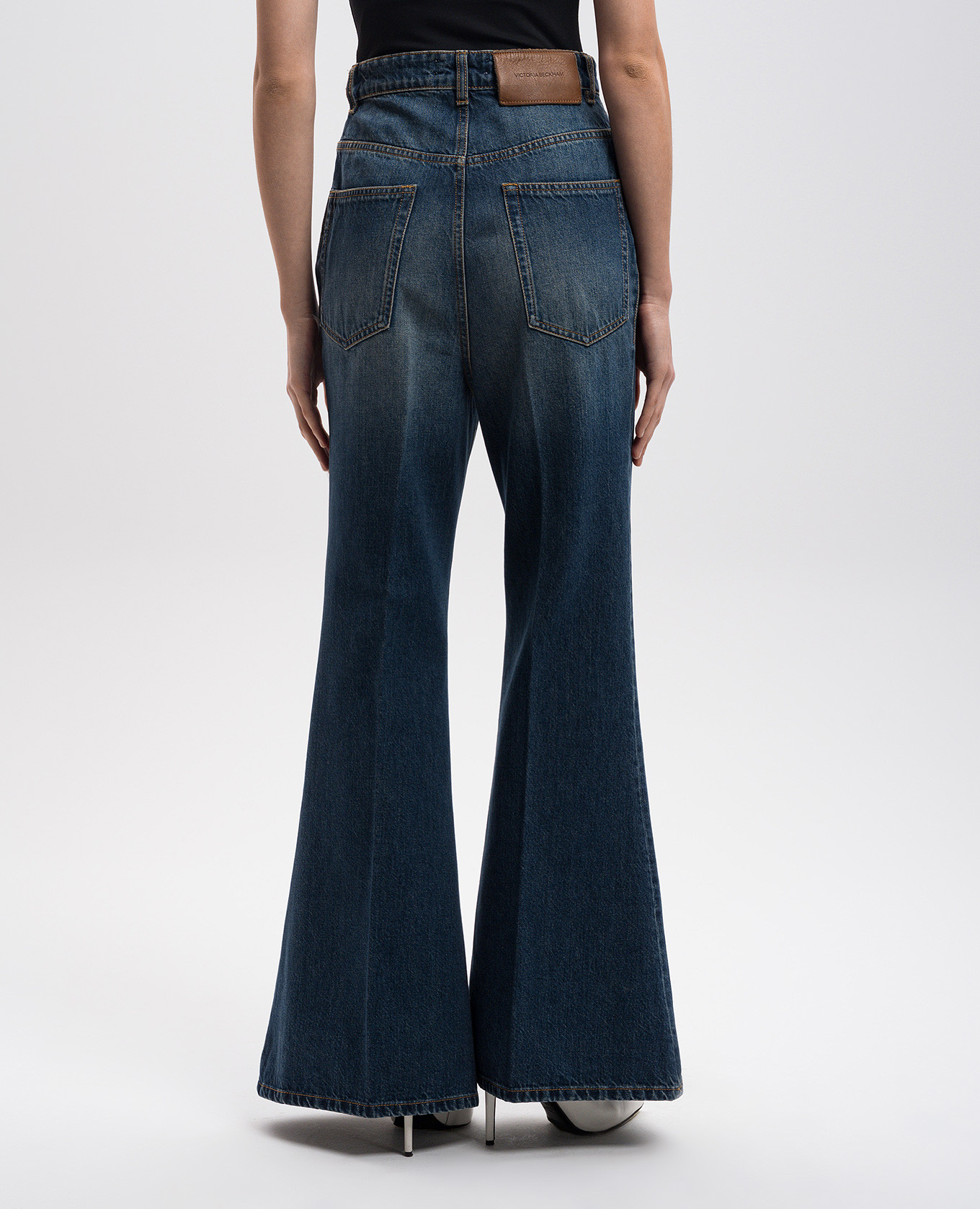 Blue flared jeans with leather logo patch Victoria Beckham 4