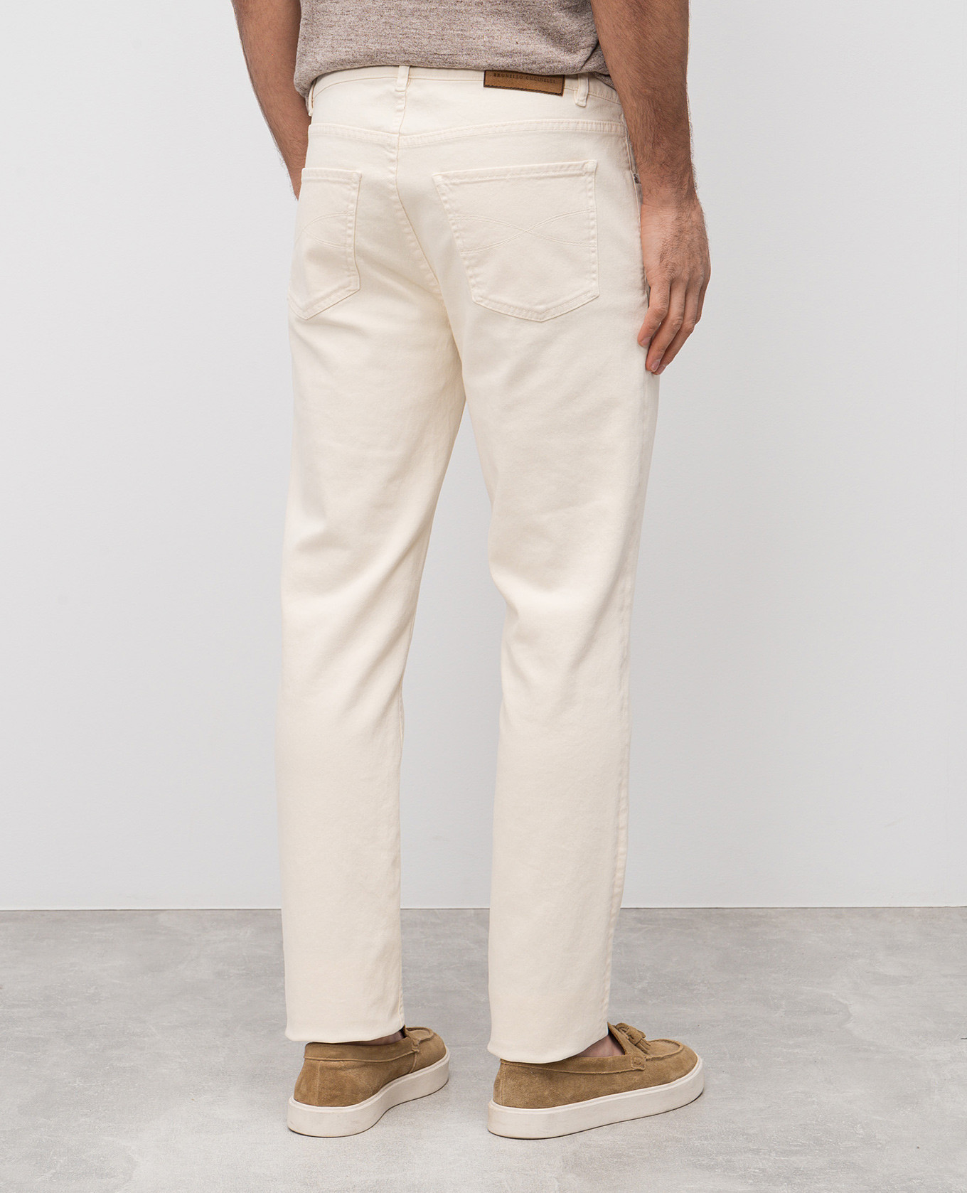 

Beige jeans with leather logo patch Brunello Cucinelli